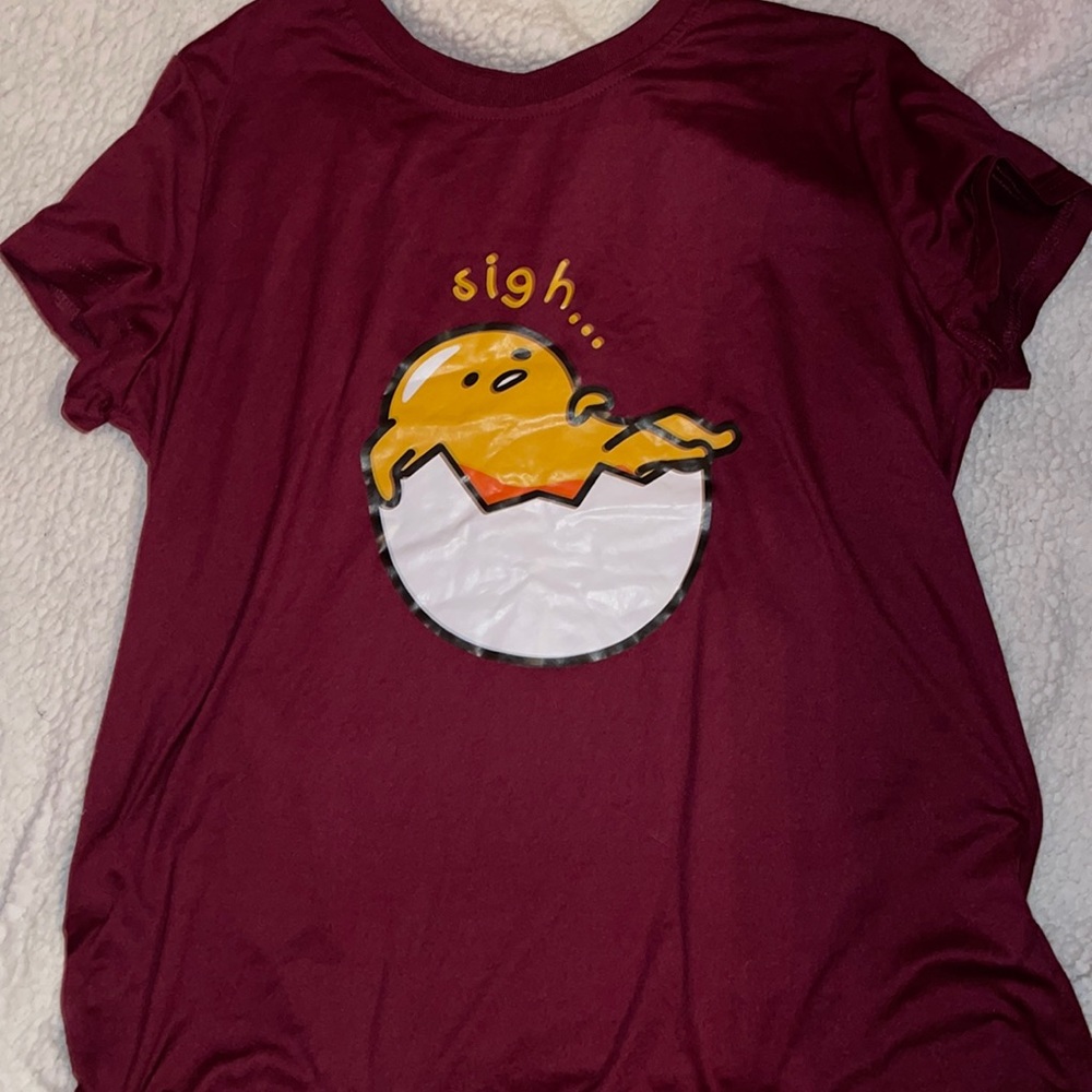 Large maroon T-shirt with cartoon print